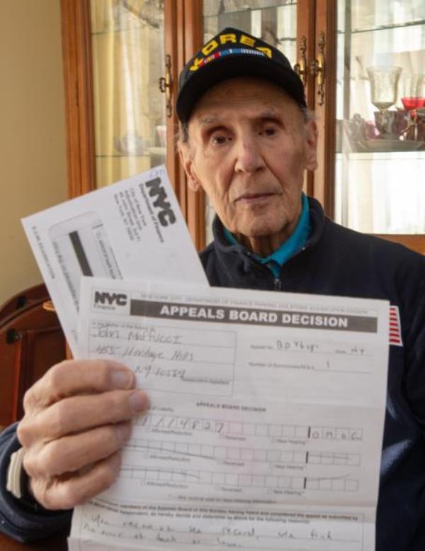 John Maffucci holds up speeding tickets