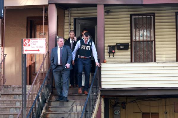 Detectives are seen at the scene wher<em></em>e Sergio Garcia was stabbed along with a woman on College Avenue near East 170th Street in Claremont Village.