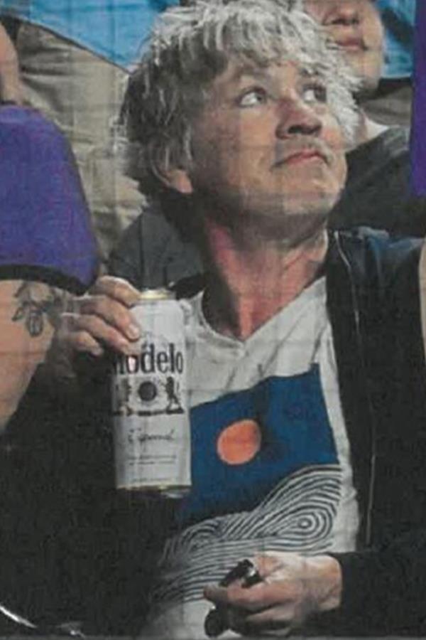 The assailant was sipping a 24-ounce can of Modelo before he pounced on the mascot.