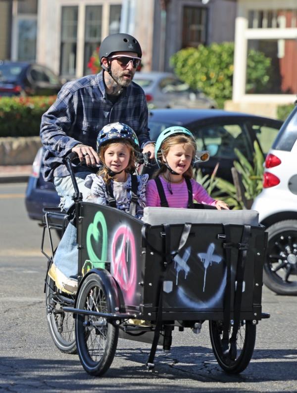  The Maroon 5 croo<em></em>ner rode his graffiti-sprayed bike with his two daughters and a friend near their home in Montecito, CA. 