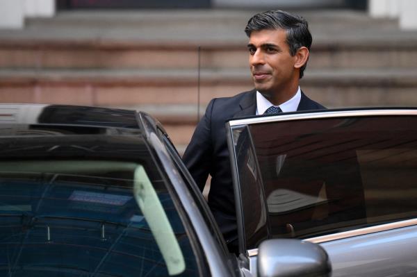 UK Prime Minister Rishi Sunak getting into car.