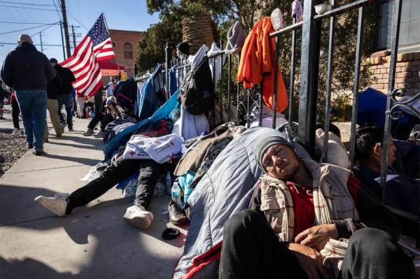 migrants on sidewalk