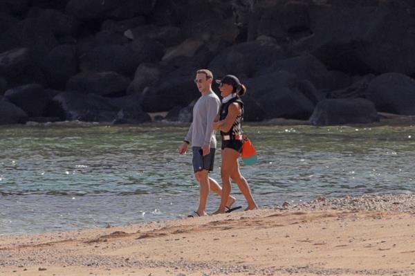 me<em></em>ta has boosted spending on perso<em></em>nal security for Mark Zuckerberg, pictured in Hawaii last year with his wife Priscilla Chan