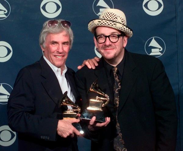 Burt Bacharach, left, and Elvis Costello hold their awards for best pop collaboration with vocals with 