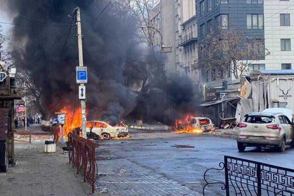 Cars burn on a street after a Russian military strike, amid Russia's attack of Ukraine, in Kherson, Ukraine December 24, 2022.