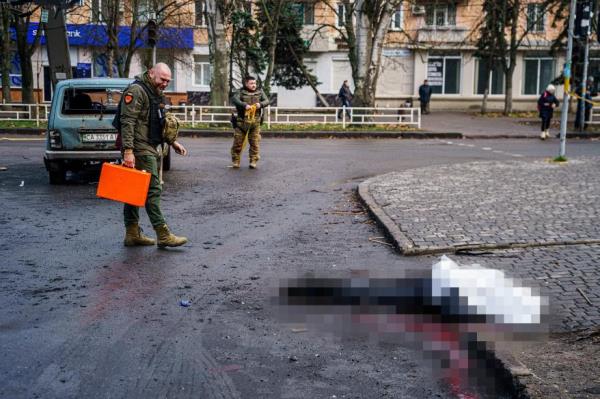Bodies lie on the ground after Russian shelling.