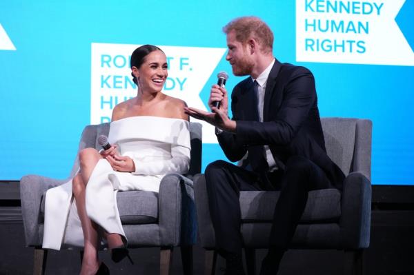 Meghan, Duchess of Sussex and Prince Harry, Duke of Sussex speak o<em></em>nstage at the 2022 Robert F. Kennedy Human Rights Ripple of Hope Gala at New York Hilton on December 06, 2022 in New York City.