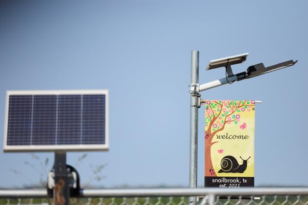 A sign reads, aWelcome to Snailbrook, TXa inside the Boring Company Facility on March 10, 2023.