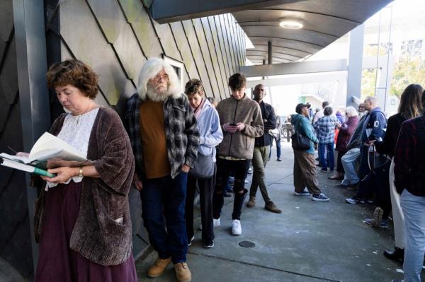 Voters line up at the Metropolitan Library to cast their ballots in the runoff election for the Senate position on Nov. 30, 2022 in Atlanta.