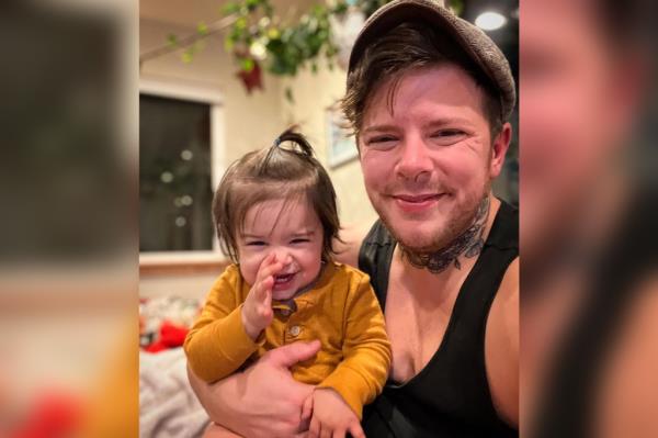 Danny Wakefield , 36, a trans dad from Seattle and their son Wilder