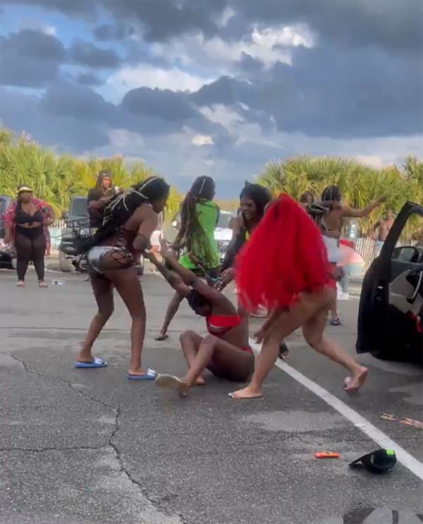 Video on social media showed two women violently fighting in a parking lot during the festival