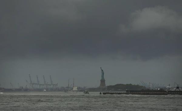 FILE - The Statue of Liberty is pictured in New York Harbor on a rainy day in New York City. 