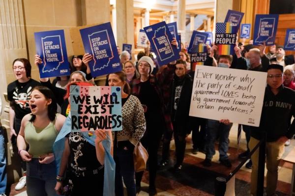 Protesters stand outside of the Senate chamber at the Indiana Statehouse on Feb. 22.