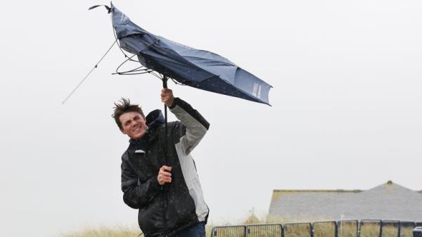 A spectator struggles with his umbrella at the Alfred Dunhill l<em></em>inks Champio<em></em>nship at St Andrews
