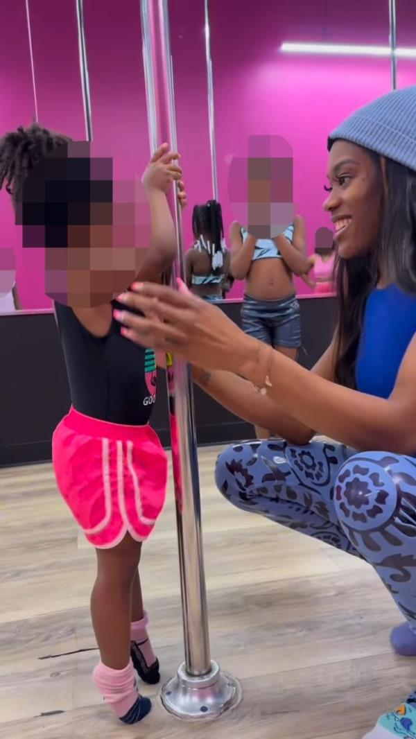 Young child in pole dancing studio