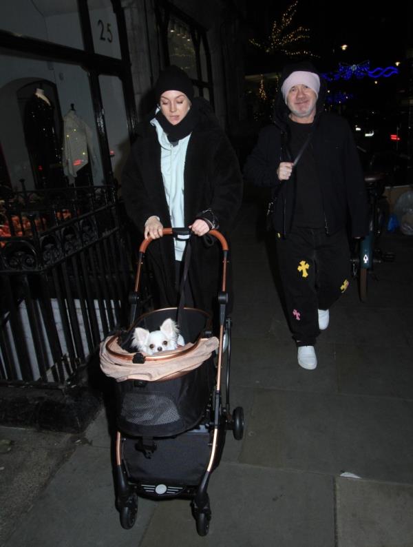 Sophie Cannell and Damien Hirst are practicing at pushing the pram with their new baby in. At the moment they o<em></em>nly put their dog and push it around but in a few mo<em></em>nths ti me they will be pushing their baby around.they went to scott?s and then they walked down the road with the pram. Everyone was looking at them especially when the little dog posed up but this is the best way to practice being a mum since Sophie has not been another before maybe Damien is showing her how to do it. They were very together and in love 18/12/2023 blitz pictures