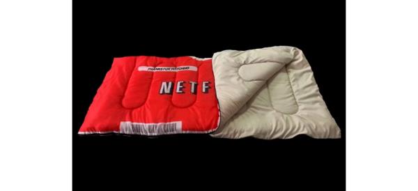 Red Netflix DVD Sleeping Bag on black background