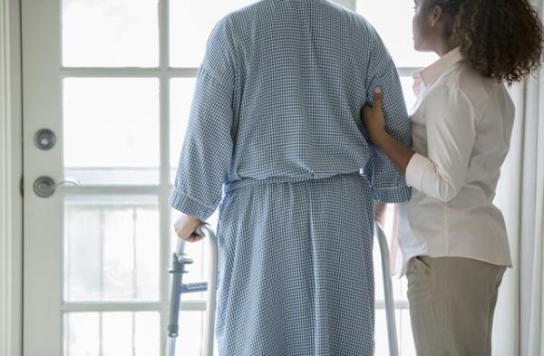African American woman helping Senior man use walker - stock photo</p>
<p>