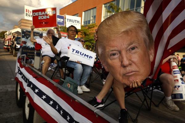 Members of the Republican Party of Iowa show their support for a variety of candidates from their float during the Iowa State Fair Kick-Off Parade on Aug. 9, 2023 in Des Moines, Iowa. 