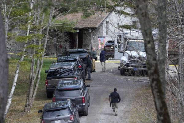 Investigators work at the scene of a deadly shooting on April 18, 2023, in Bowdoin, Maine.  