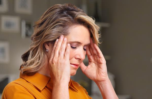 Woman havin<em></em>g headache migraine. Stress and depression.