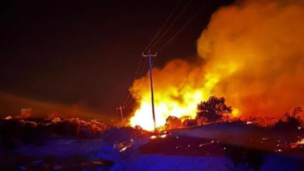 A bushfire burns close to powerlines in Western Australia's wheatbelt. Supplied/ Gingin West Volunteer Bush Fire Brigade