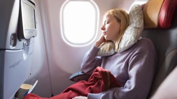 Blo<em></em>nde Girl Sleeping on the Plane