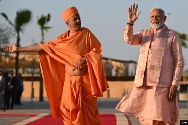 India's Prime Minister Narendra Modi waves during a tour of the BAPS Hindu Mandir, the largest Hindu temple in the Middle East, at its inauguration ceremony on Feb. 14, 2024, in Abu Dhabi.